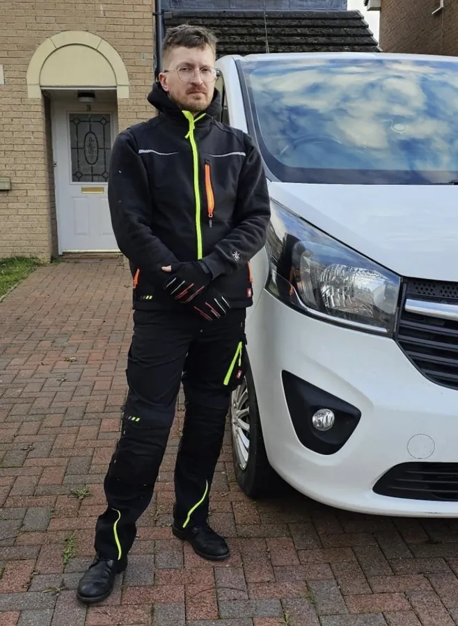 One of our locksmiths beside the work van